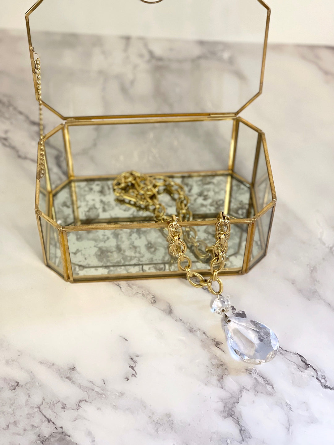 Heirloom Crystal Drop Necklace styled with vintage glass jewelry box