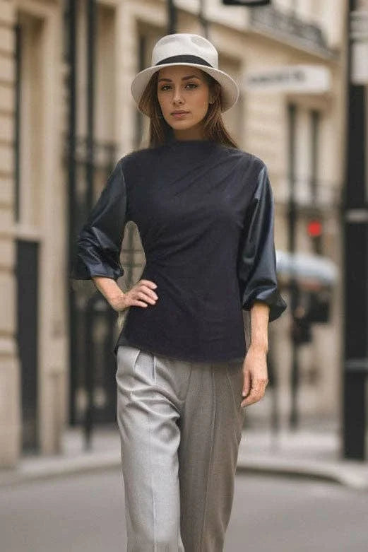 Betty black stretch knit top with contrasting bubble sleeves and mock neckline