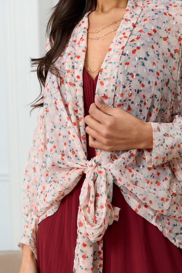 Close-up of floral Lurex fabric and front tie detail