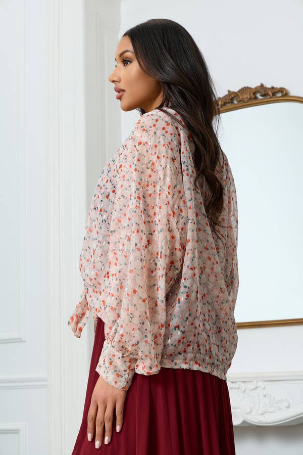 Back view of sheer blush floral kimono top with statement sleeves