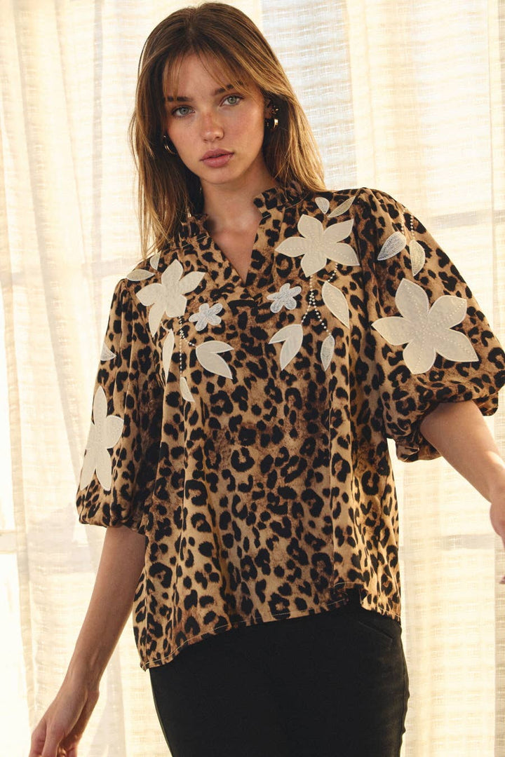 Wildflower Leopard Appliqué Top featuring ivory flowers, puff sleeves and split neckline