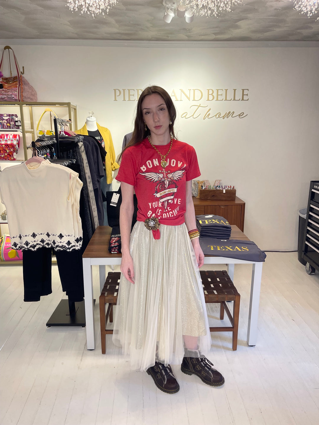 Model wearing red Bon Jovi Bad Medicine graphic tee with cream shimmer tulle skirt