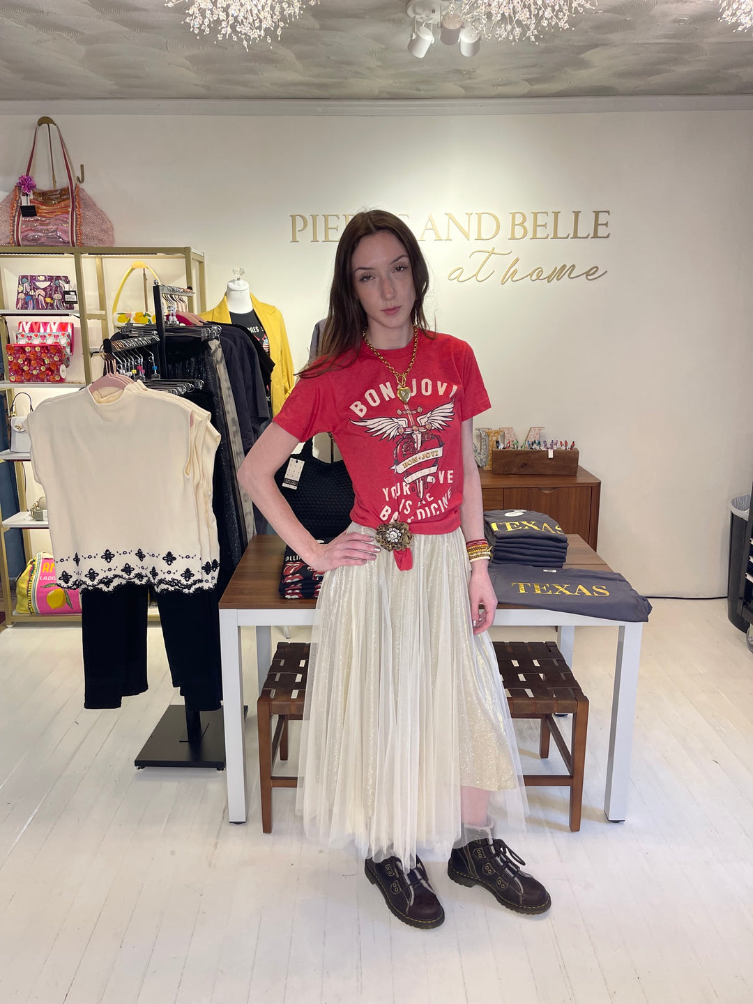 Model wearing red Bon Jovi Bad Medicine graphic tee with cream shimmer tulle skirt