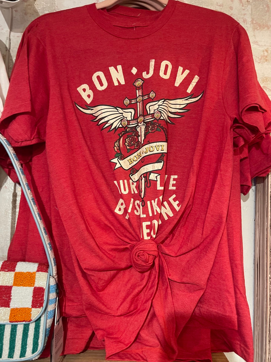 Bon Jovi Bad Medicine red licensed graphic band tee with winged heart and dagger design