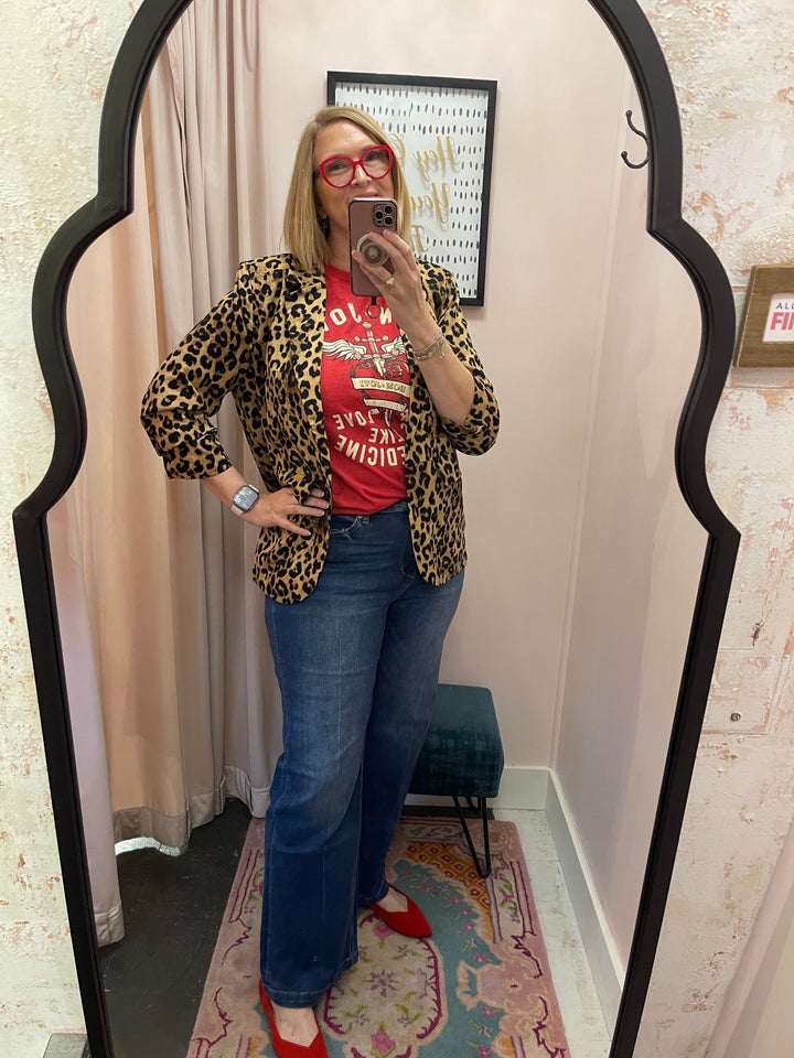 Bon Jovi red graphic tee styled with leopard blazer, wide leg jeans and red shoes