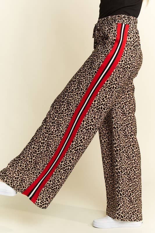 Red black and white side stripe detail on leopard wide leg pants