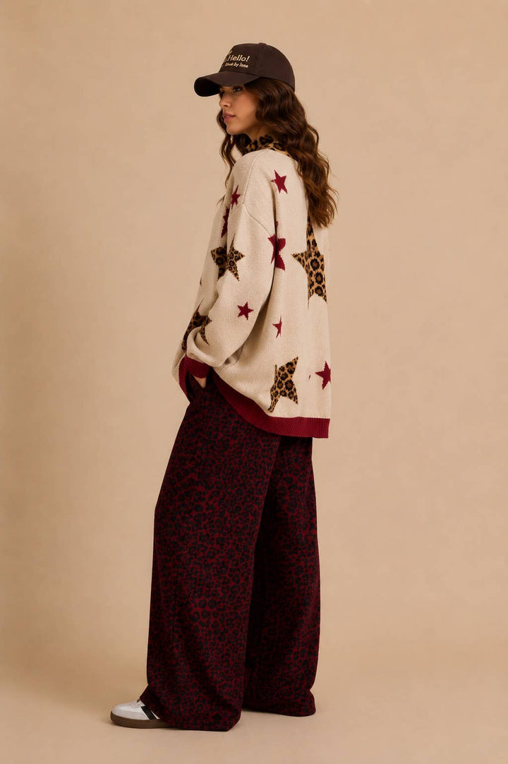 Side view of oversized oatmeal cardigan with leopard and red star pattern