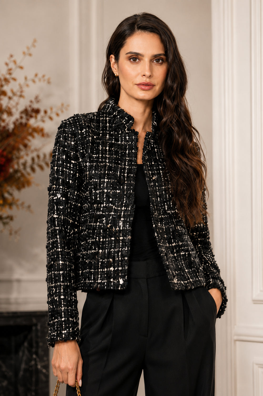 Black textured tweed cropped jacket with silver sequins styled with black trousers