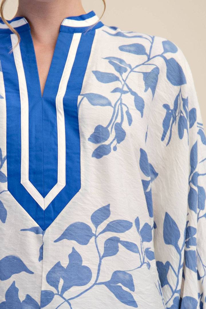 Close-up of Ink & Ivory Blue blouse showing cobalt and ivory V-neck placket trim