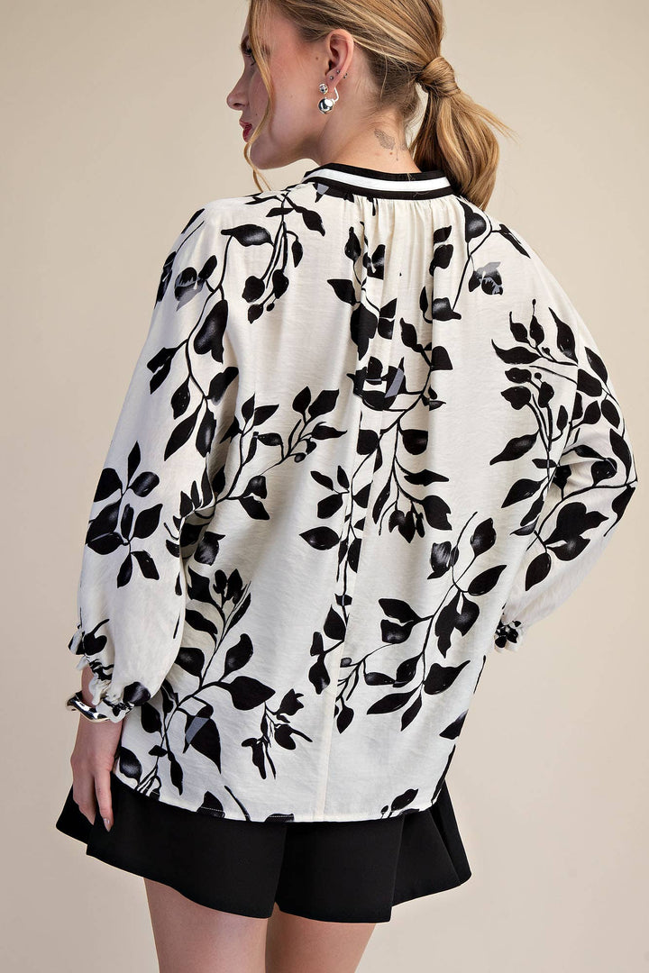 Back view of Ink & Ivory botanical blouse showing relaxed silhouette and gathered neckline