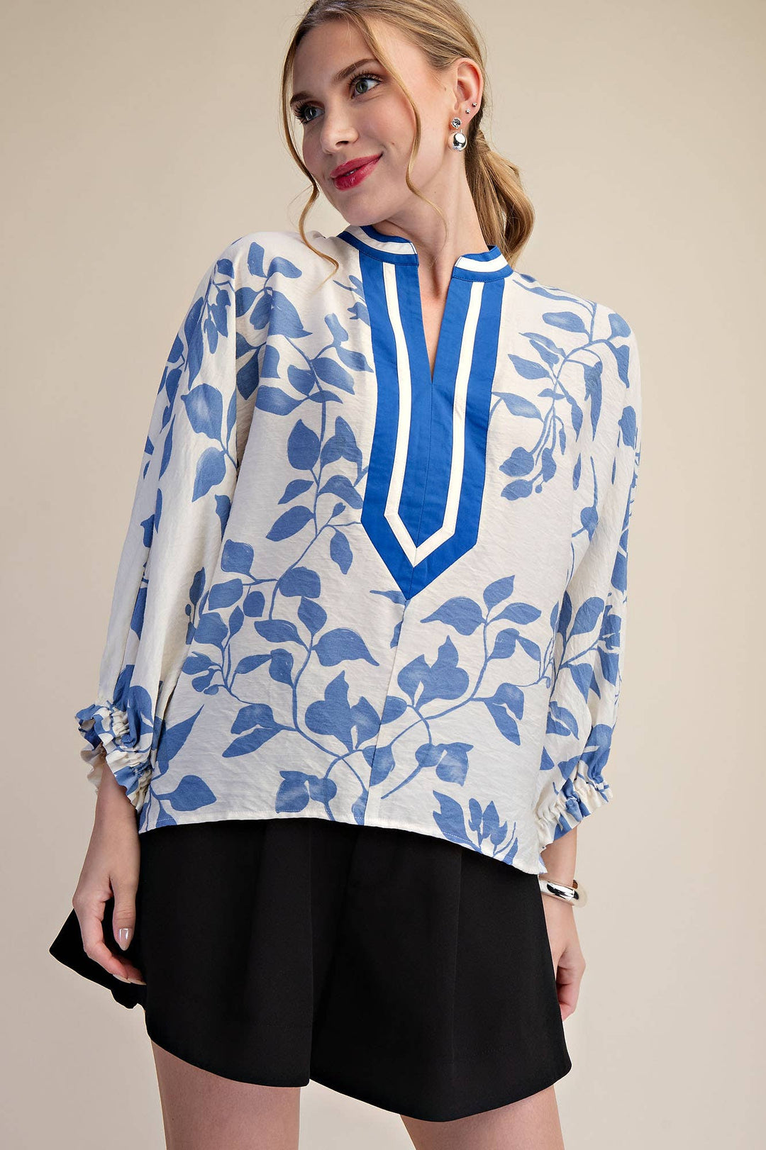 Front view of Ink & Ivory Blouse in Blue with botanical print and relaxed blouson sleeves