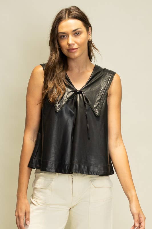 Black faux leather sleeveless top featuring an oversized sailor collar, V-neckline and feminine tie-front detail.