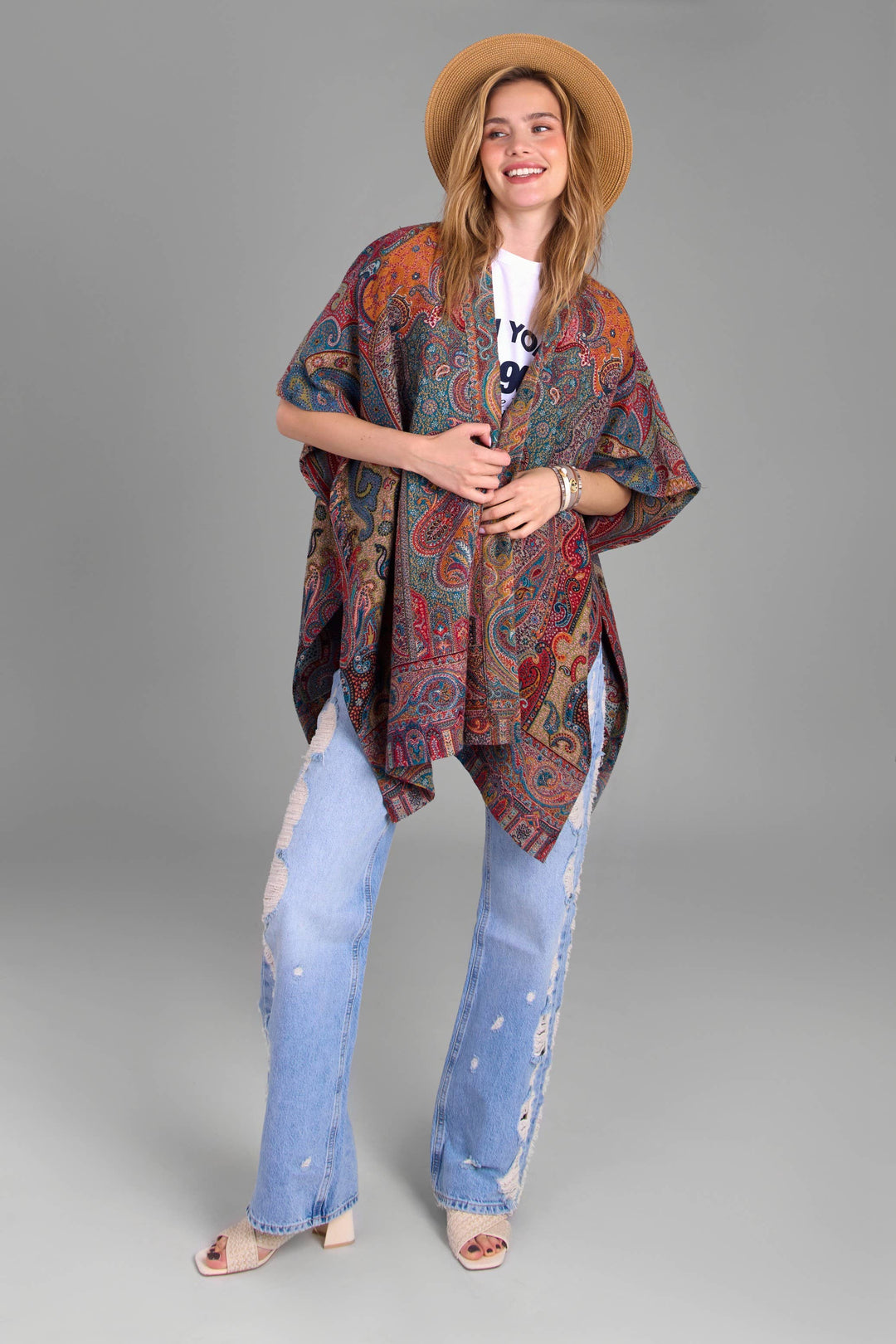 Regal Rococo multicolor paisley poncho by SAACHI styled with denim
