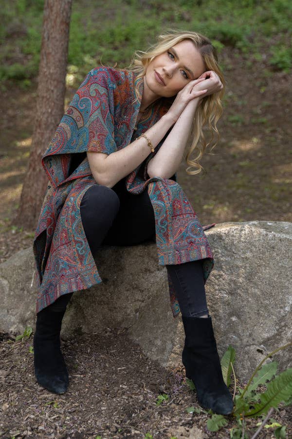 SAACHI Regal Rococo paisley poncho styled over black