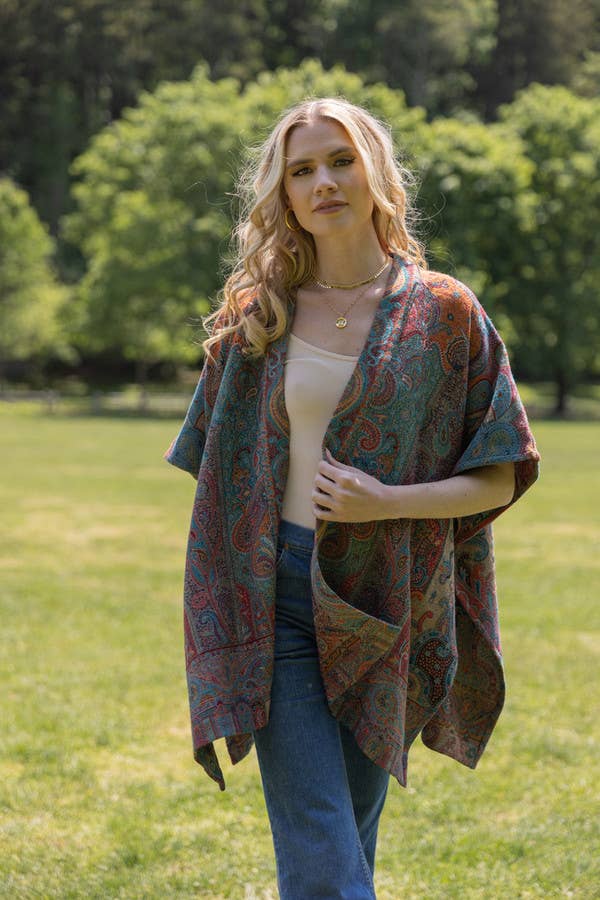 Regal Rococo poncho by SAACHI styled with jeans