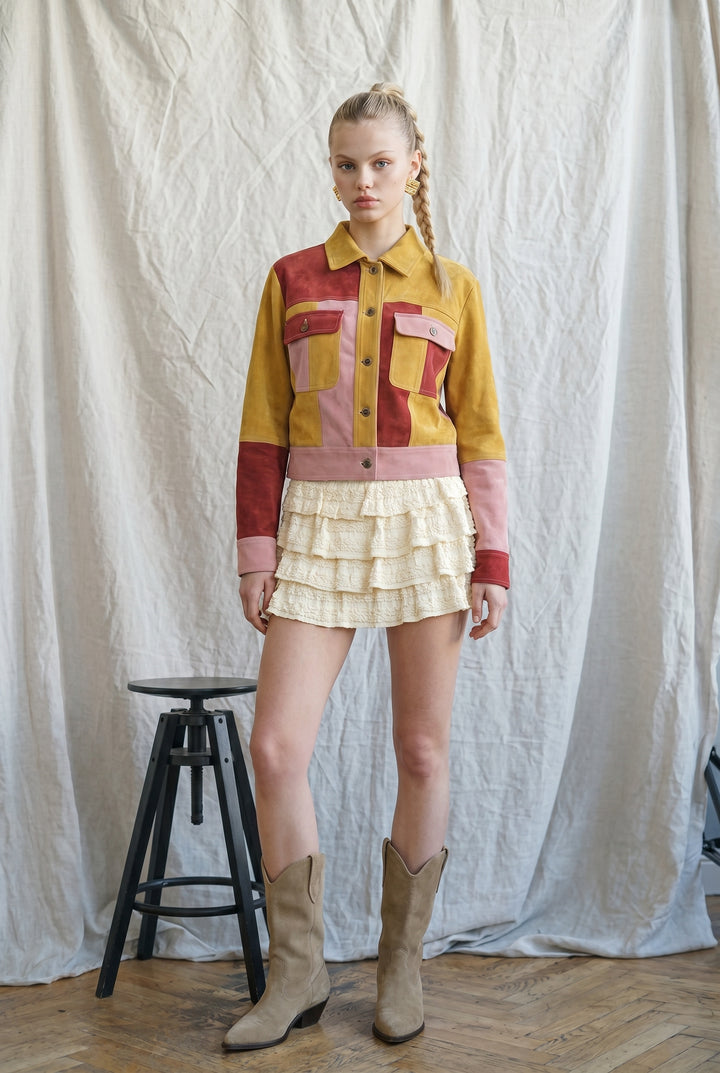 Mustard, rust and blush pink colorblock suede jacket with pointed collar, button front, patch pockets and cropped silhouette.