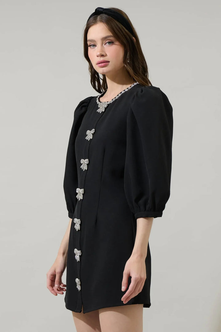 Black rhinestone bow mini dress with three-quarter puff sleeves side view