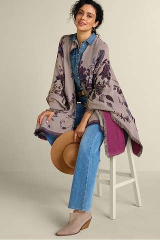 Midnight floral ruana wrap styled with denim shirt and jeans