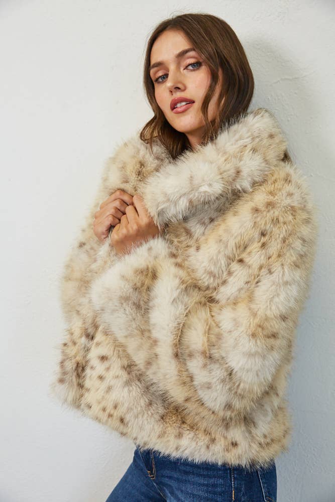 Close side view of Wild Intentions faux fur coat highlighting the oversized collar and soft plush texture.