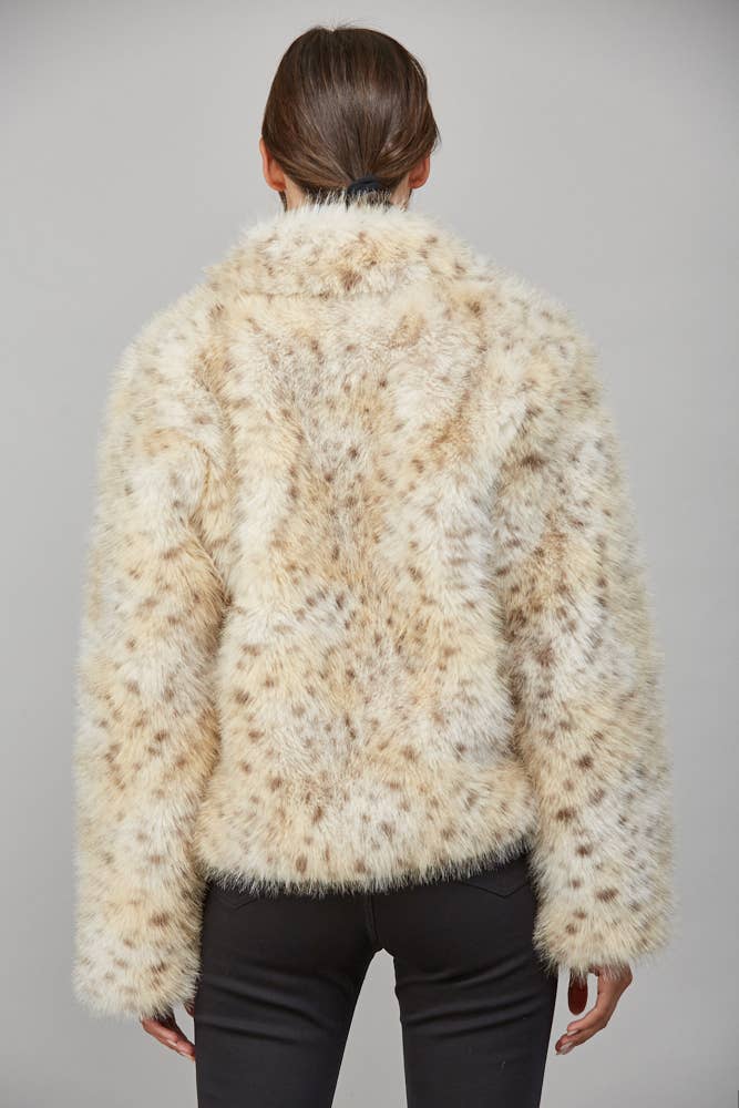 Back view of Wild Intentions cream spotted faux fur coat showing cropped hem and full plush texture.