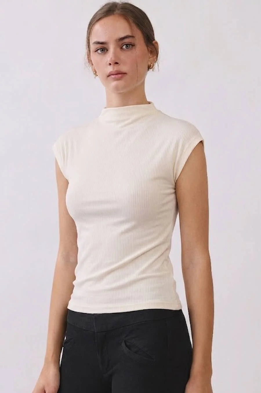 Women's ivory ribbed mock neck sleeveless top with cap sleeves and a fitted silhouette, front view.