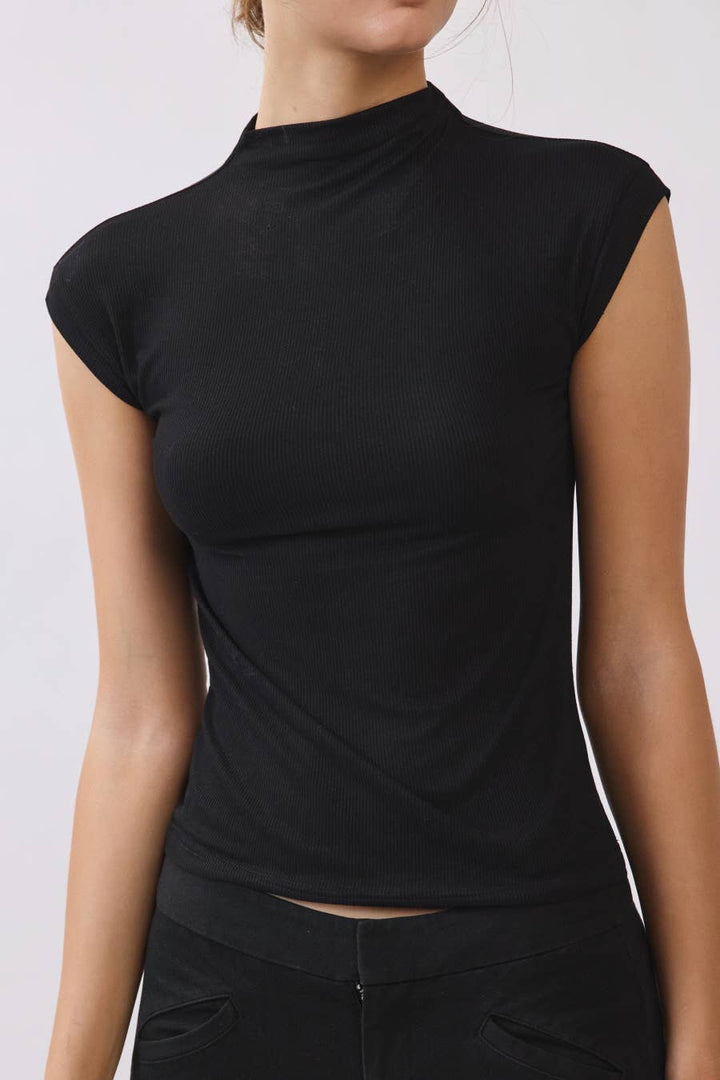 Close-up of black ribbed mock neck top showing the fitted silhouette, cap sleeves, and soft ribbed texture.