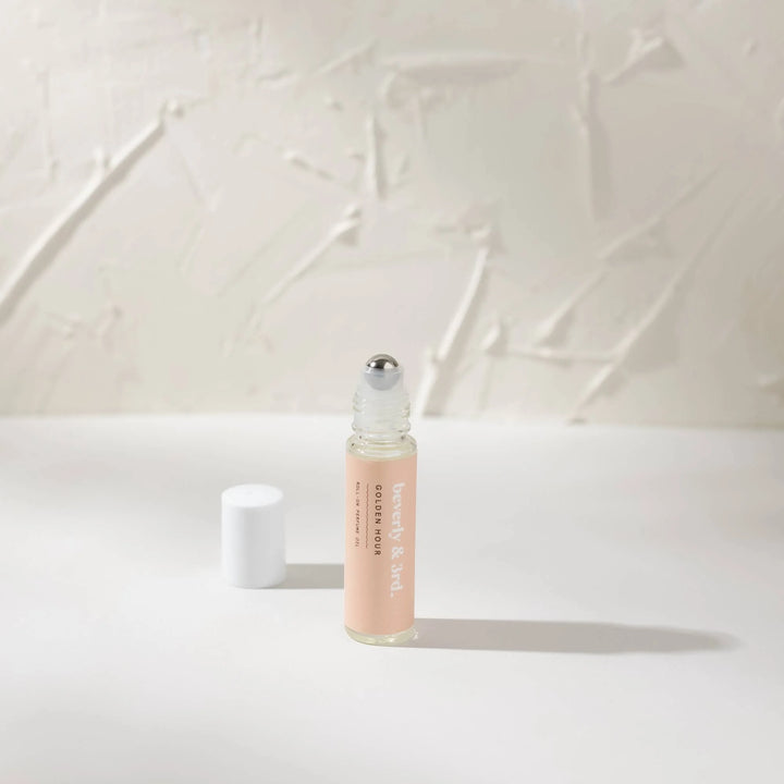 10ml roll-on perfume bottle with coconut, sandalwood and cedar fragrance notes.