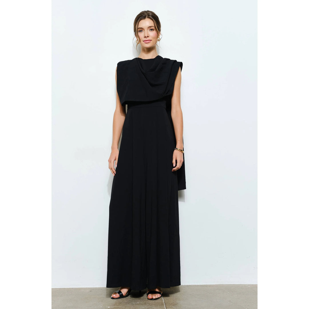 Front view of elegant black sleeveless jumpsuit with flowing wide legs and statement scarf-neck detail