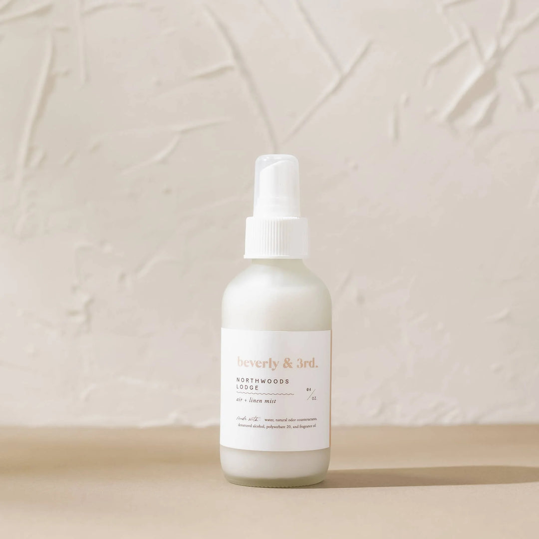 Northwoods Lodge Air + Linen Mist in 4 oz frosted glass bottle with cedar, amber and cashmere fragrance notes.