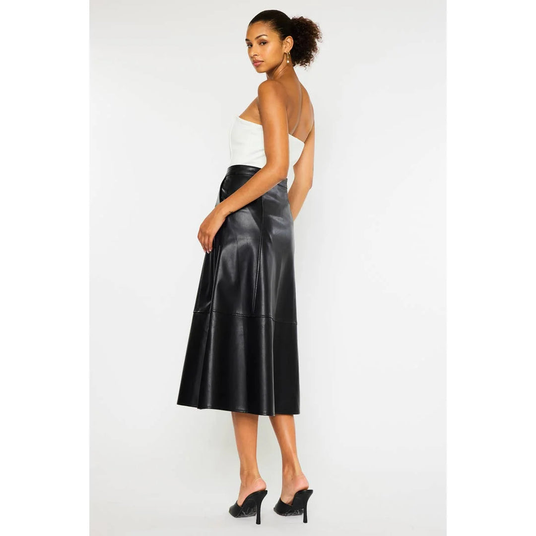 Side view of black Rebel Luxe faux leather midi skirt featuring structured panels and a flared midi hem