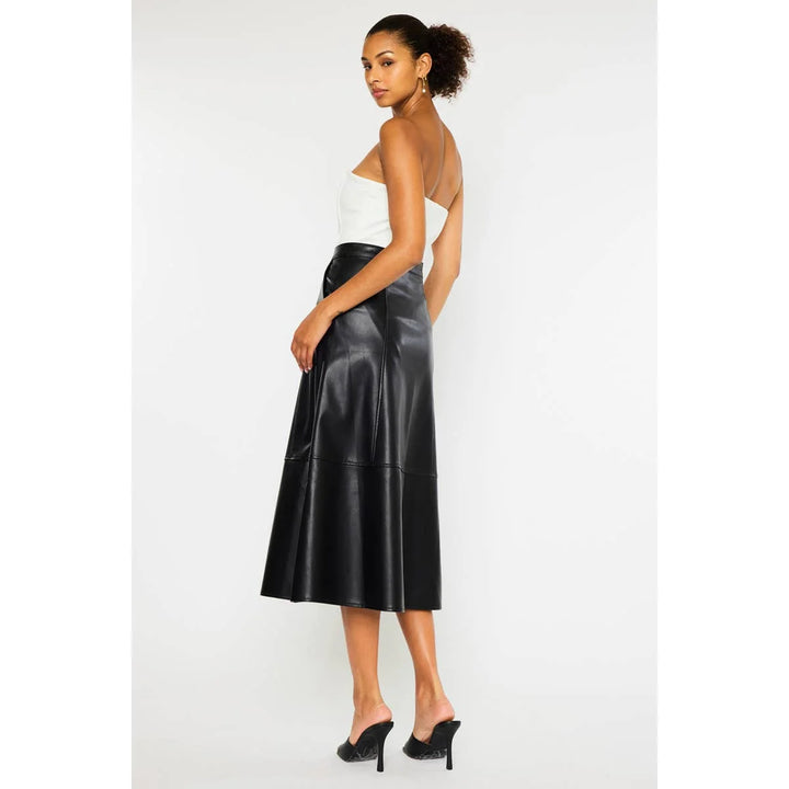 Side view of black Rebel Luxe faux leather midi skirt featuring structured panels and a flared midi hem