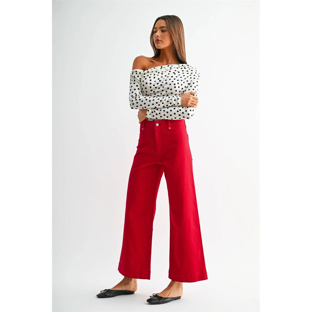 Full-length view of Red Hot red jeans showing the wide leg silhouette.