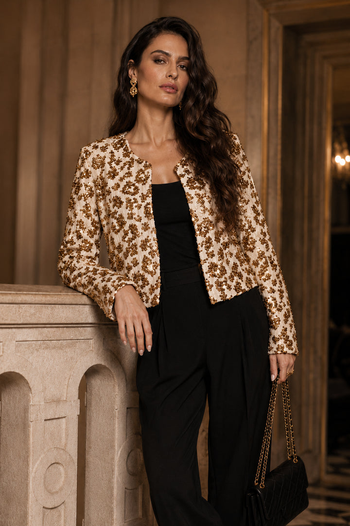 The Gilded Hour gold and ivory sequin cropped jacket styled over an all-black outfit