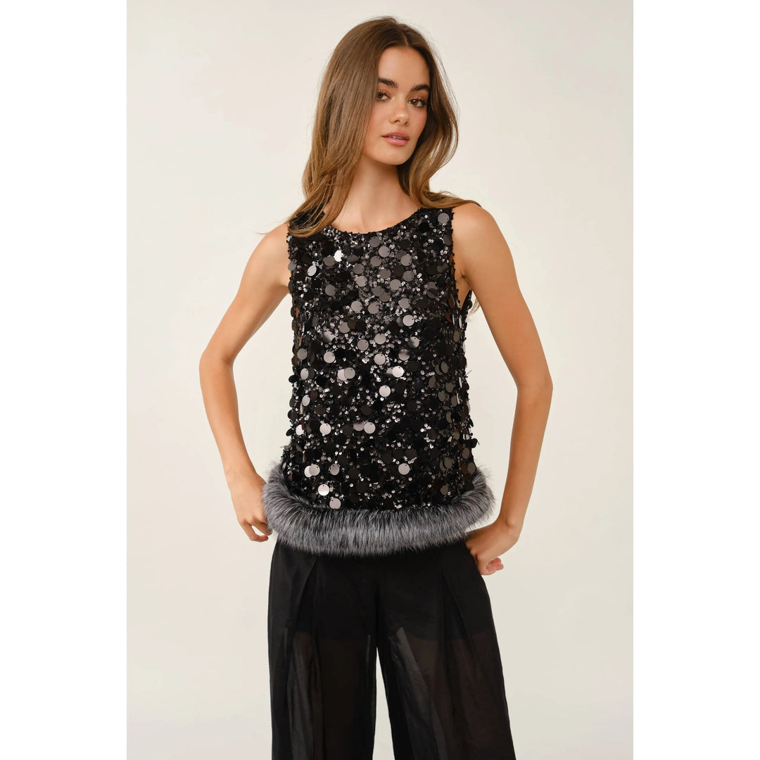 Black sleeveless statement top with oversized sequins and gray faux fur hem