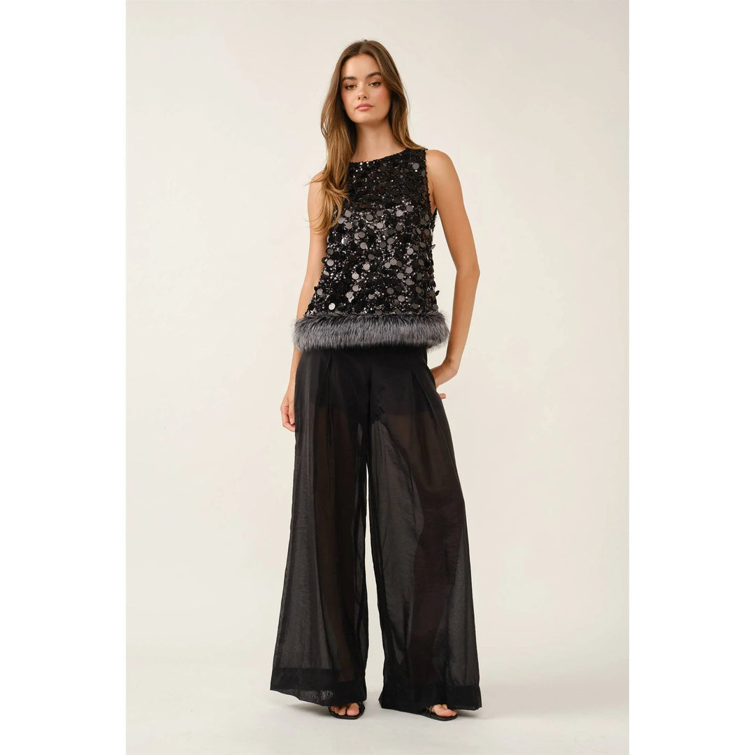Fur the Drama sequin top styled with black wide-leg pants for a party look