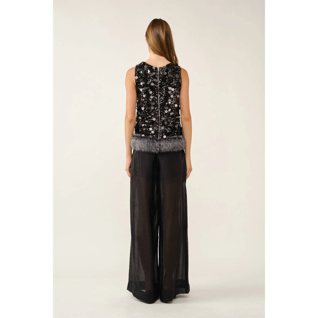 Back view of Fur the Drama black sequin top showing center back zipper and faux fur hem